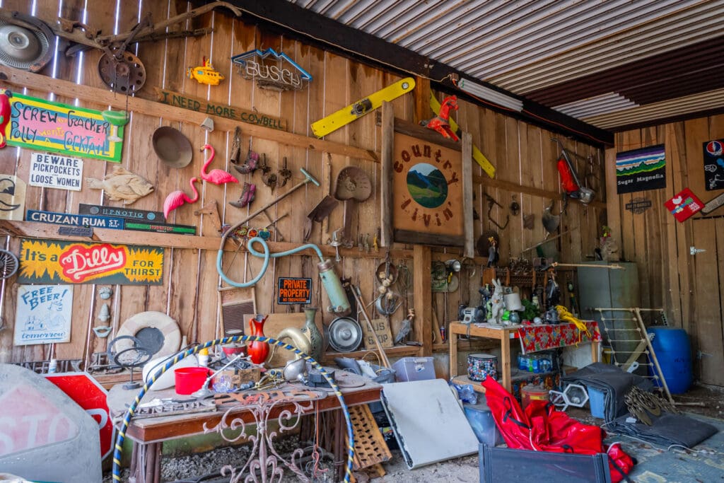 The "Junk Wall" featuring vintage signs and items fixed on a wooden wall