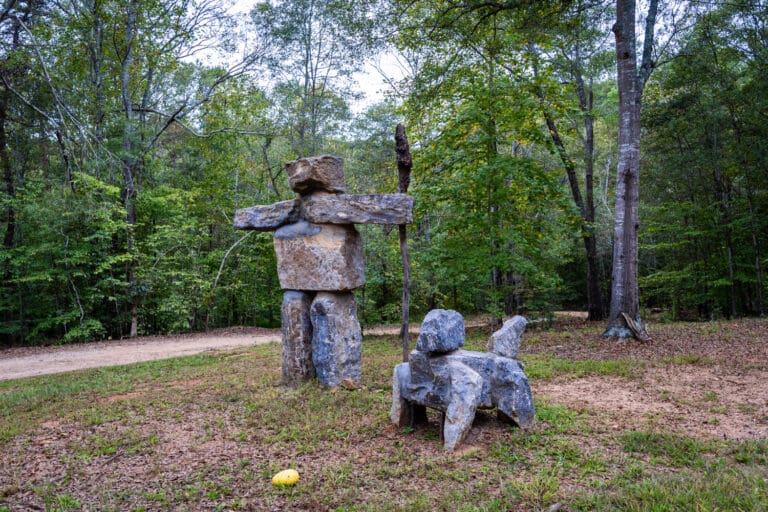 The Stone Man statue and Troxie dog statue